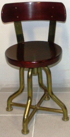 Swivel-chair in mahogany and brass. 1950's.